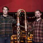 Simeon and Mark showing off their copper still at a Minnesota Distillers Guild meeting
